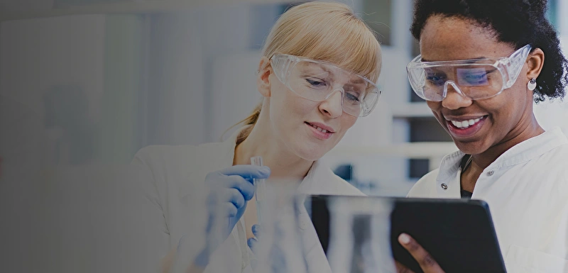 Two laboratory scientists analysing results from an experiment.