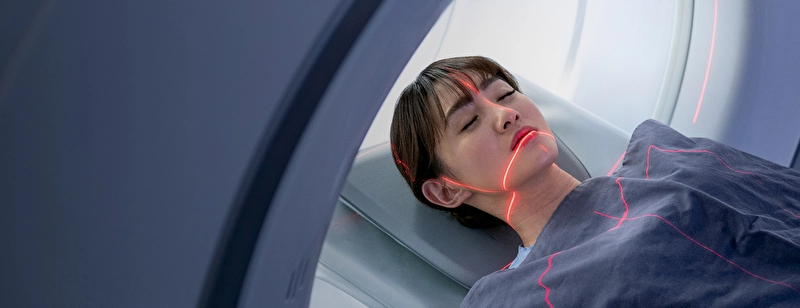 A patient is getting a magnetic resonance imaging scan.