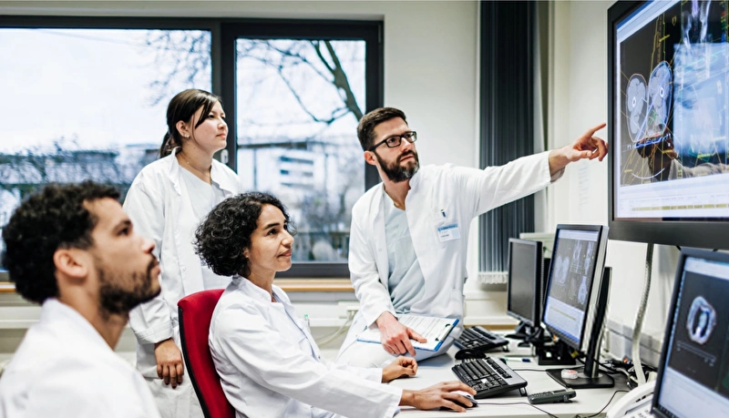 Radiologists investigating results from a scan.