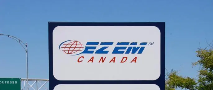 Image of E-Z-EM Canada Logo with trees and the sky in the background