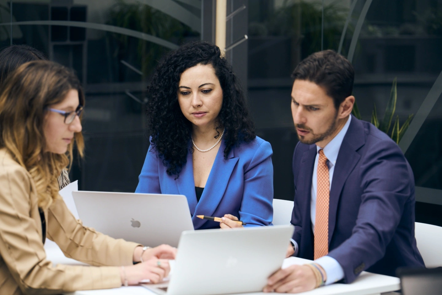 Three people having a conversation.