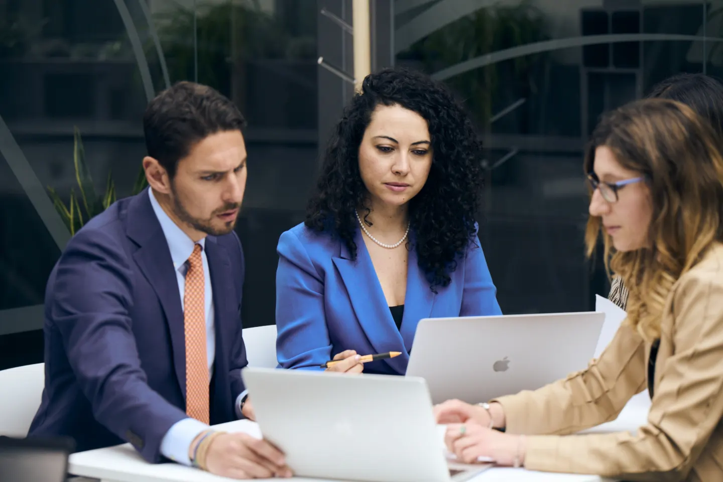 Three people having a conversation.